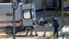 Medical workers transport a patient suspected of having COVID-19 to a hospital in Moscow on June 26. 
