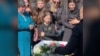 Mourners near Kyiv honor Anna Yefymenko, a young mother who was killed while protecting her four-year-old son on May 18.