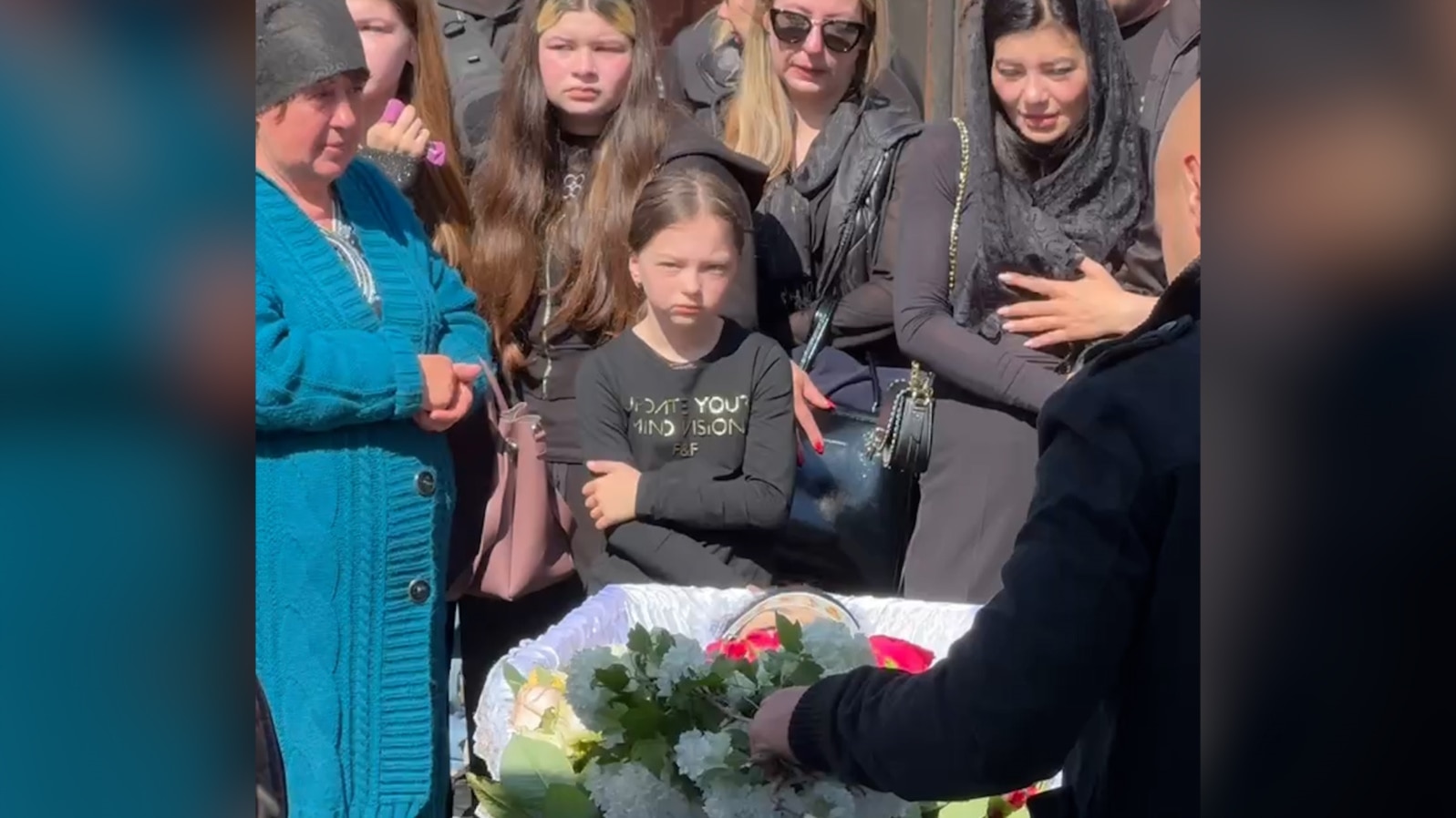 Mourners near Kyiv honor Anna Yefymenko, a young mother who was killed while protecting her four-year-old son on May 18.