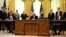 U.S. President Donald Trump (center), Kosovar Prime Minister Avdullah Hoti (right), and Serbian President Aleksandar Vucic (left) listen to U.S. Vice President Mike Pence during a signing ceremony for an economic normalization deal between the two Balkan countries in Washington on September 4. 