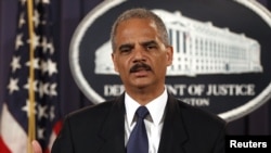 U.S. Attorney General Eric Holder announces charges of terrorism violations against 14 people for providing resources to the foreign organization Al-Shabab.