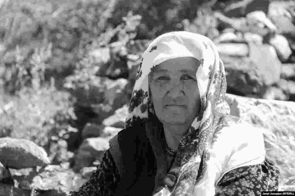 A woman pauses while returning from the Tandy-Kol hot springs, believed to have healing qualities. The springs are so hot that locals can cook eggs in the water in seven minutes.