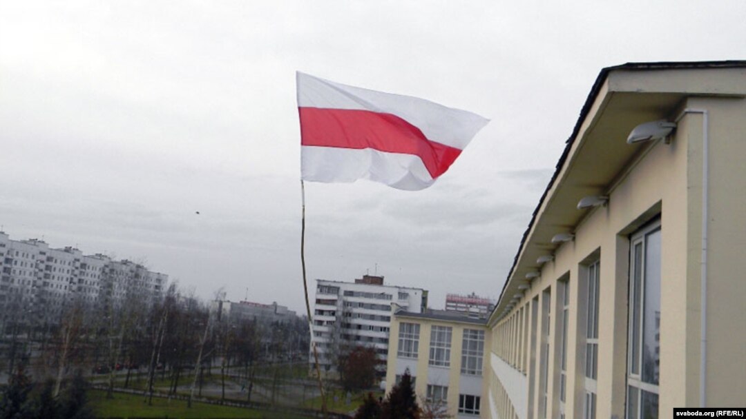 The banned Belarusian national flag flies in Vitebsk in December.