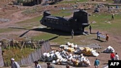 A CH-47 Chinook relief helicopter lands near Kalam in Swat Valley