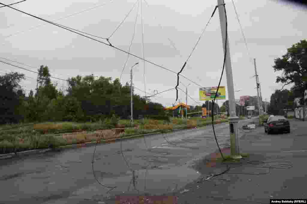 Damaged electical cables dangle into the streets. 