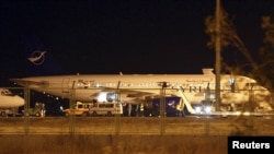 A Syrian passenger plane that was forced to land sits at Esenboga airport in Ankara.