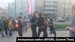 Police detain the boy in Moscow's city center on May 27.