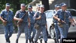 Armenia - Armed police officers are seen outside a Yerevan police building seized by anti-government gunmen, 17Jul2016.