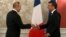 French President Emmanuel Macron (rights) meets with Russian President Vladimir Putin in Osaka in June.