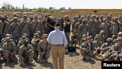 U.S. Defense Secretary Robert Gates speaks to the U.S. troops during a visit to Camp Victory in Baghdad on April 7.