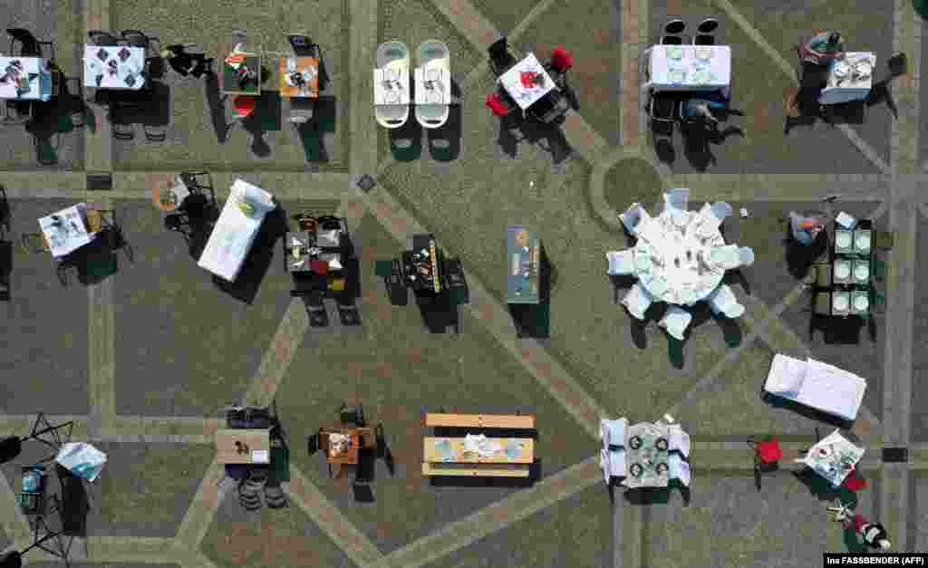 An aerial view shows tables in front of city hall in Dortmund, Germany, during a protest by struggling restaurant owners.