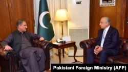 Pakistani Foreign Minister Shah Mahmood Qureshi meets with Zalmay Khalilzad, the U.S. Special Representative for Afghanistan Reconciliation, at the Foreign Ministry in Islamabad on April 5.