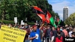 Afghans rally in front of the Iranian embassy in London against to protest violence against Afghan immigrants in Iran. June 14, 2020. 