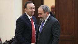 Armenia -- Prime Minister Nikol Pashinian (R) and Constitutional Court Chairman Hrayr Tovmasian shake hands ahead of a 2018 meeting in Yerevan.