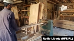 A carpenter at work in Kunar.