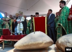 Prominent members of the Orthodox clergy preside over the laying of the cornerstone for the Holy Trinity church.