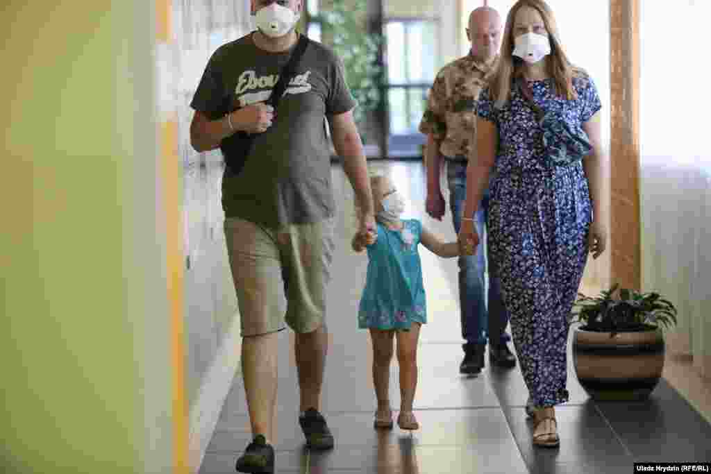 A family enters the polling station at School No. 41 in Minsk.