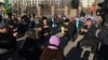 Гражданские активисты слушают слова молитвы в память о жертвах Жанаозенских событий 2011 года и Декабрьских событий в Алматы 1986 года. Алматы, 16 декабря 2015 года. 