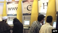 Iranians surf the Internet at a cafe in Tehran. Now they will be able to access addresses they can write in Persian.