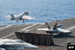 Portavionul USS George H.W. Bush transportă, potrivit unor surse, mii de soldați americani în Orientul Mijlociu (fotografie de arhivă).