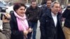 Azerbaijani investigative journalist Khadija Ismayilova (left) outside the Prosecutor General's Office in Baku in February with her lawyer Elton Guliyev. Ismayilova fears she will soon be detained as part of a crackdown on civil society in Azerbaijan. 