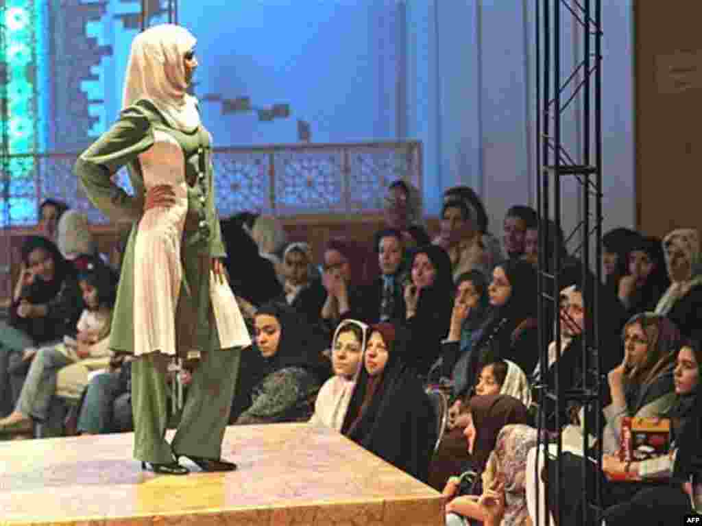 An Iranian woman models clothes at an Islamic fashion show. Modest Islamic fashions have been touted as an alternative to improper Western styles.