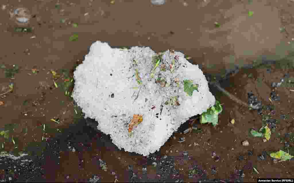 A detailed view of an ice chunk made up of hail that clumped together in the summer floodwaters &nbsp; There were no reports of injuries from the freak storm, but the floodwaters carried tons of ice into some houses. &nbsp; &nbsp;