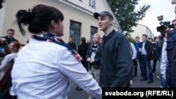 Opposition activist Zmitser Dashkevich greets relatives, including wife Nasta, and well-wishers on after his release from prison early on August 28.