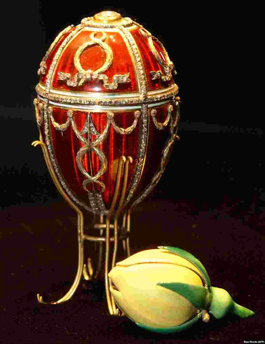 The Rosebud Egg, the first that Nicholas II gifted to his wife, Aleksandra. A cupid&#39;s arrow made from diamonds enlivens the red lacquer, while inside, an enamel rosebud symbolizes the love blooming between the newlyweds. A year after this egg was presented, a stampede at a celebration following Nicholas&#39;s coronation killed hundreds in the crowd. Following the advice of relatives, Nicholas proceeded with the coronation celebrations as ordinary Russians mourned their dead. It was his first fateful mistake as tsar.