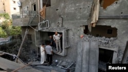 Здание в секторе Газа, разрушенное в результате авиаударов, 12 июля 2014