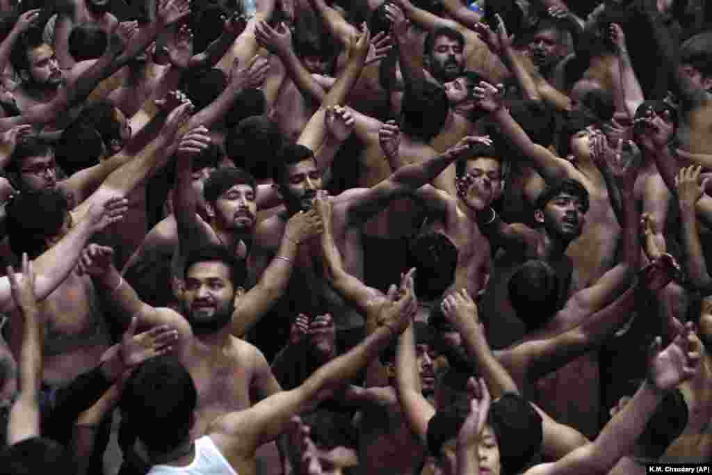 Pakistani Shi&#39;ite Muslims beat their chests during a procession to mark the end of the 40-day mourning period following the anniversary of the seventh-century martyrdom of Imam Hussein, the Prophet Muhammad&#39;s grandson and one of Shi&#39;ite Islam&#39;s most beloved saints, in Lahore. (AP/K.M. Chaudary)