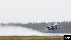 An F-16CM fighter jet takes off from Kallax Airport outside Lulea in northern Sweden.