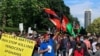 Afghans rally in front of the Iranian embassy in London against to protest violence against Afghan immigrants in Iran. June 14, 2020. 