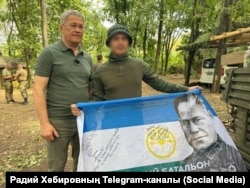 Bashkortostan region head Radiy Khabirov (left) meets with volunteer soldiers from the region near the front line in Ukraine earlier this month.