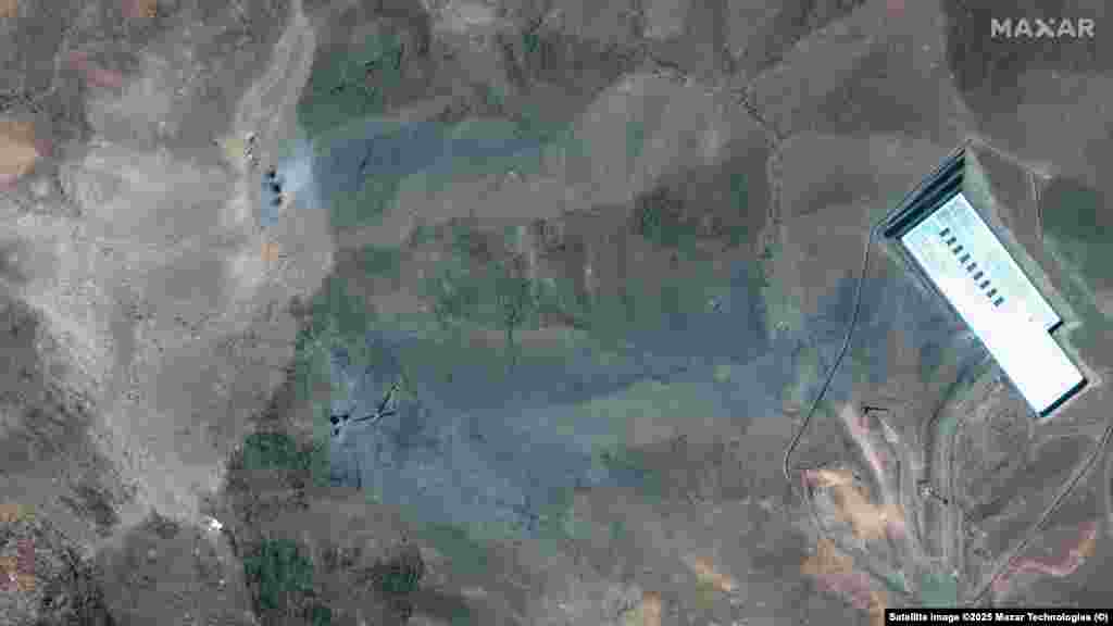 Craters and ash can be seen on a ridge at the Fordow complex in imagery taken after the strikes.