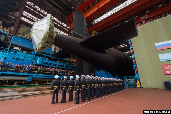 Members of the Russian Navy attend the launch of the 885M Yasen-M nuclear submarine K-571 Krasnoyarsk at the Sevmash shipyard in Severodvinsk in July 2021.