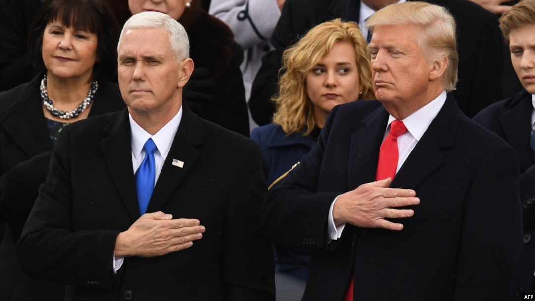 U.S. Vice President Mike Pence (left) has warned Iran "not to test the resolve" of President Donald Trump's administration