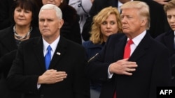 U.S. Vice President Mike Pence (left) has warned Iran "not to test the resolve" of President Donald Trump's administration