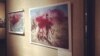 Photos at the exhibition in Moscow were doused with red paint. 