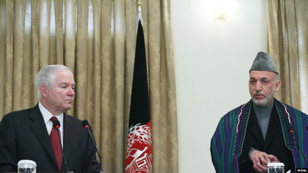 U.S. Defense Secretary Robert Gates speaks alongside Hamid Karzai on December 8.