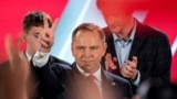Polish presidential candidate Karol Nawrocki, backed by the main opposition Law and Justice (PiS) party, reacts to the exit polls of the second round of the presidential election, in Warsaw, Poland, June 1, 2025