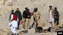 Pakistani security officials inspect the site of a bomb blast that targeted the vehicle of Frontier Corps, in Quetta, Balochistan Province on January 2.