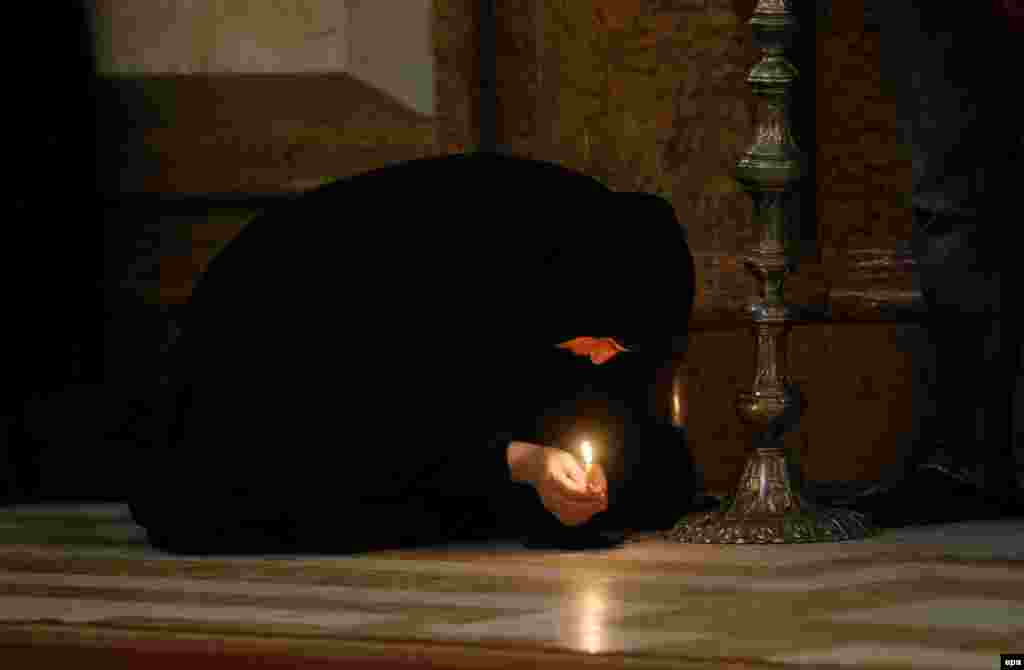 A Georgian nun attends a religious service marking Maundy Thursday at the Trinity Cathedral in Tbilisi. Maundy Thursday is a Christian feast which always falls on the Thursday before Easter Sunday. (epa/Zurab Kurtsikidze)