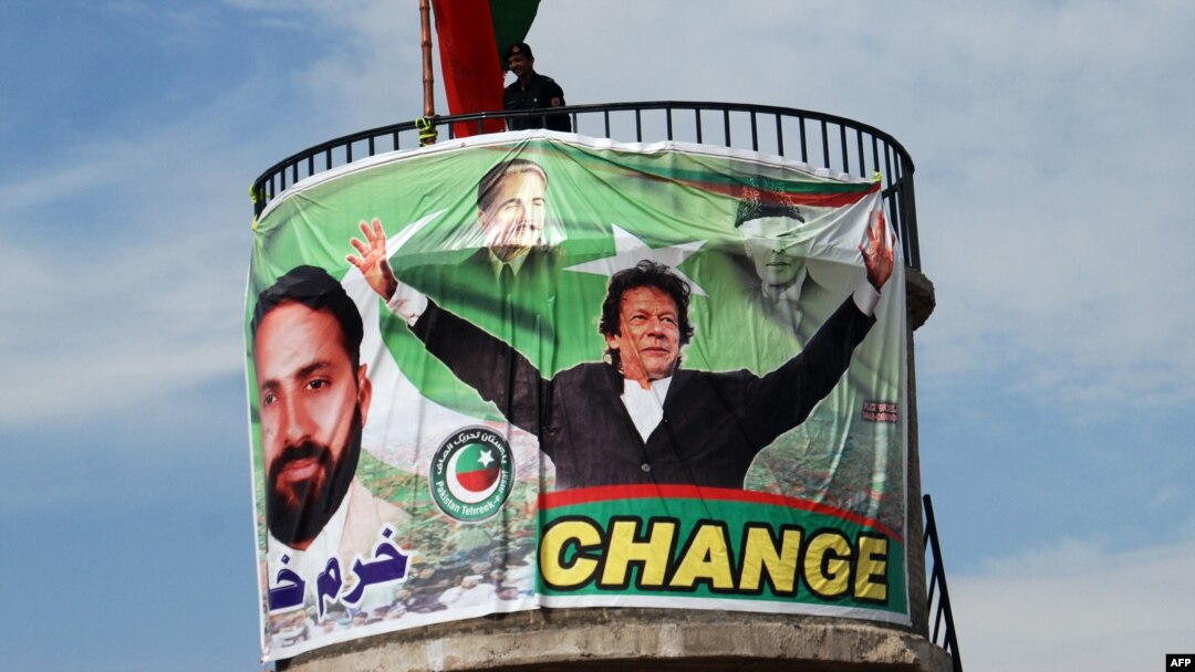 A Pakistani policeman stands guard on top of a water tank during an election campaign meeting by cricket legend and Pakistan Tehrik-e Insaaf party leader Imran Khan in the northwestern town of Mansehra on May 3.