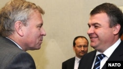 NATO's Jaap de Hoop Scheffer (left) meets with Russia's Anatoly Serdukov in Brussels