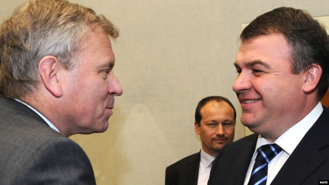 NATO's Jaap de Hoop Scheffer (left) meets with Russia's Anatoly Serdukov in Brussels