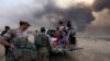 Displaced people seek refuge while fleeing from clashes during an operation to attack Islamic State militants in Mosul on October 19. 