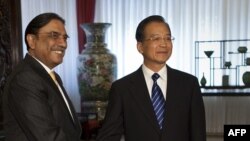 Pakistani President Asif Ali Zardari (left) and Chinese Prime Minister Wen Jiabao shake hands during their meeting at Zhongnanhai in Beijing in July.