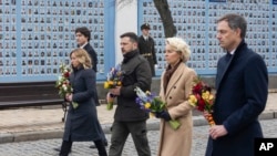 Canadian Prime Minister Justin Trudeau (left), Italian Prime Minister Giorgia Meloni (second left), Ukrainian President Volodymyr Zelenskiy (center), EU Commission President Ursula von der Leyen (second right), and Belgian Prime Minister Alexander De Croo attend a ceremony at the Wall of Remembrance in Kyiv on February 24, the second anniversary of Russia's full-scale invasion of Ukraine. 