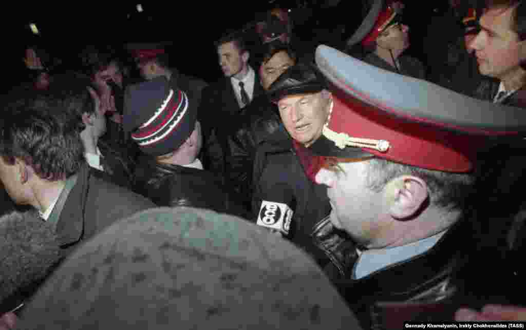 Luzhkov talks to reporters in Red Square after a terrorist captured a bus with South Korean students on board on October 15, 1995.